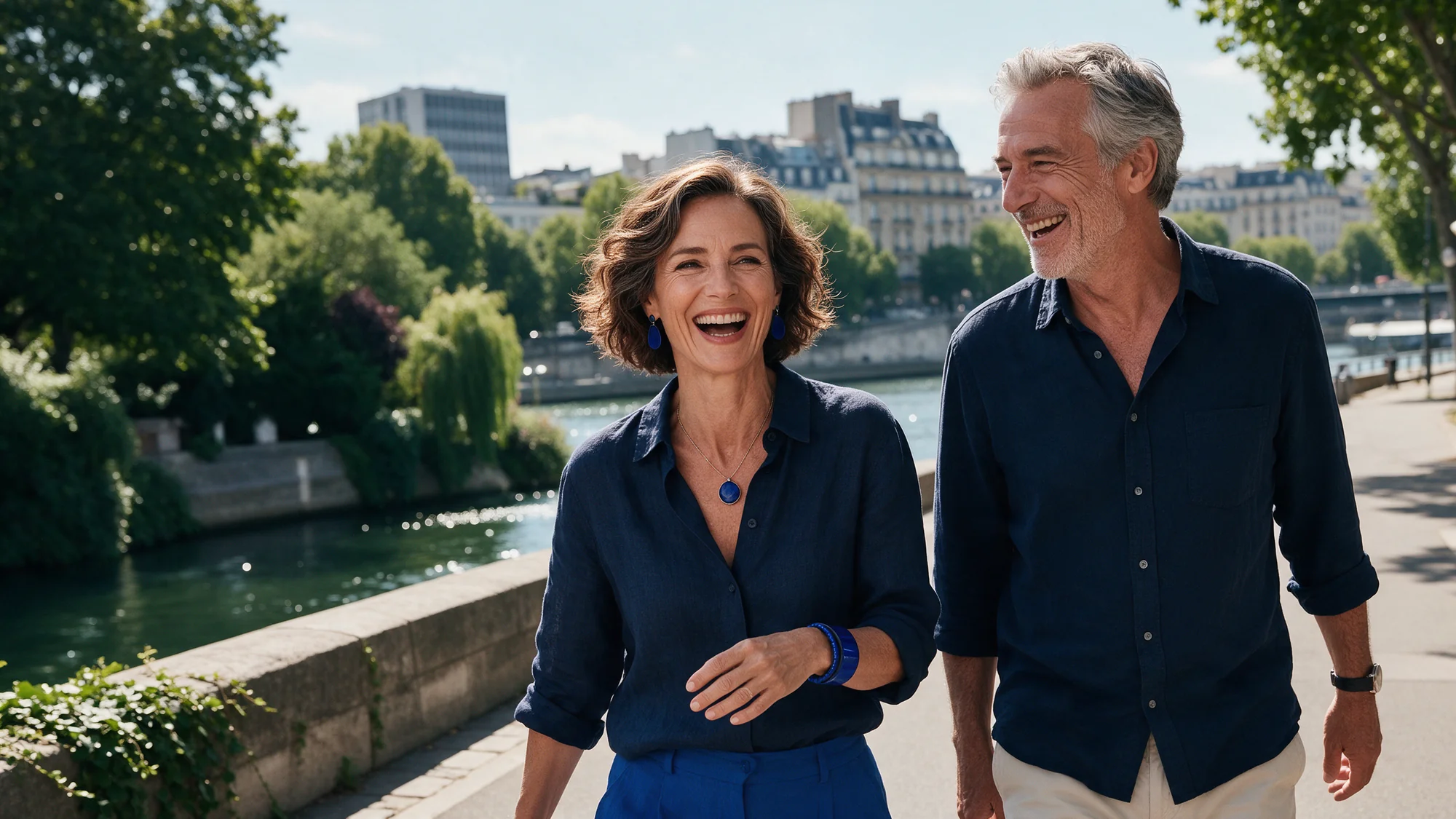 Two friends in their fifties enjoying a riverside walk.